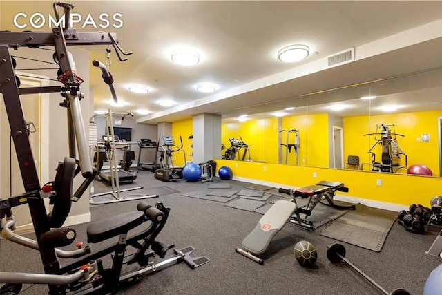 workout area with visible vents and baseboards