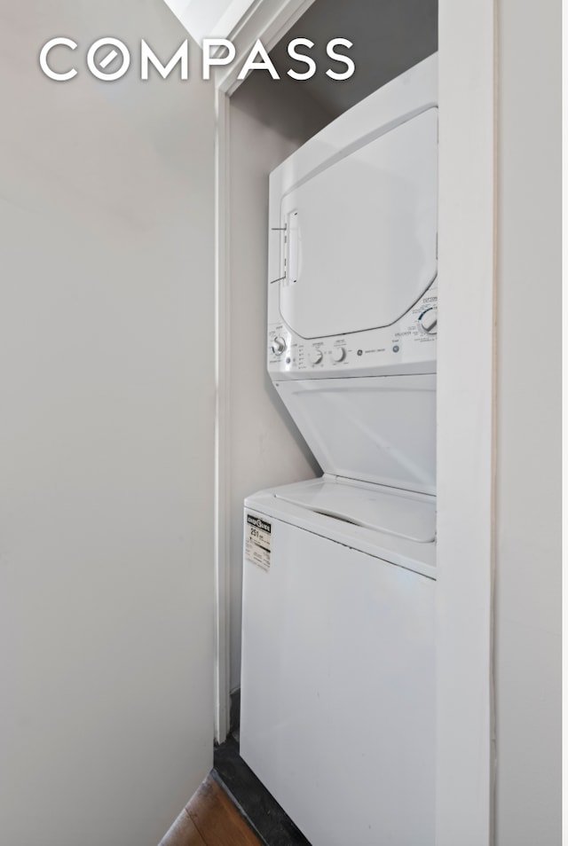 laundry area featuring laundry area and stacked washer and dryer