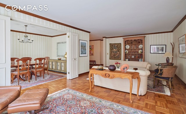 living room featuring light parquet floors, crown molding, and a notable chandelier