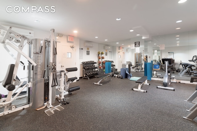 180 E 79th St Unit 5A, New York City, NY 10075 - workout area featuring an AC wall unit and recessed lighting