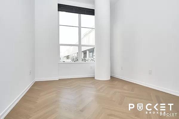 unfurnished room with parquet floors