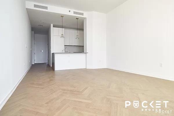 interior space featuring a sink, visible vents, and baseboards