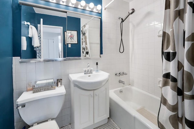 full bathroom featuring toilet, shower / tub combo, vanity, tile walls, and tasteful backsplash