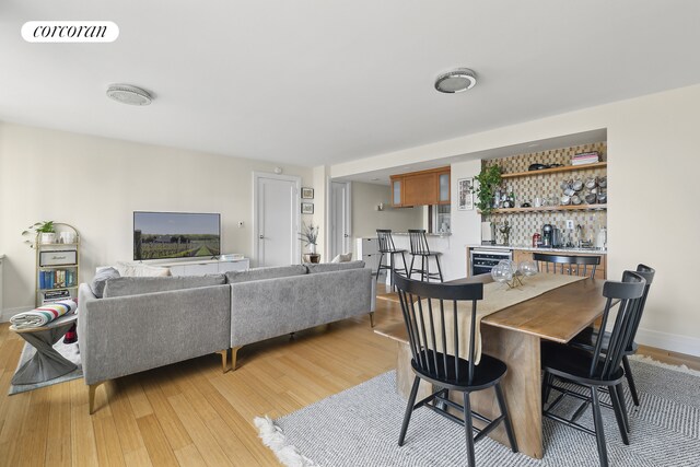 kitchen featuring sink, decorative backsplash, light stone countertops, and appliances with stainless steel finishes