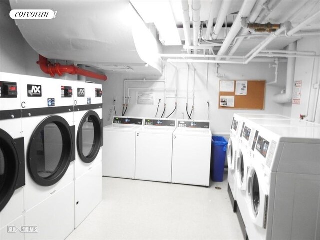 shared laundry area featuring washing machine and clothes dryer