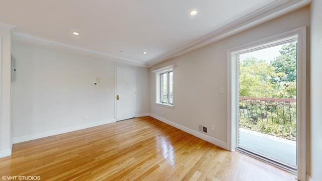 unfurnished room with light wood-type flooring, crown molding, baseboards, and recessed lighting