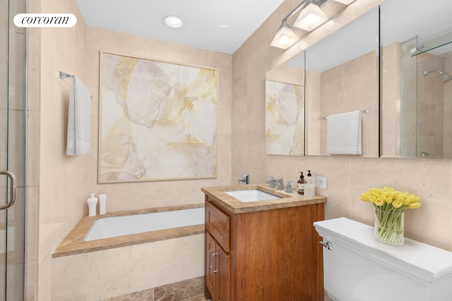 full bath with tile walls, a shower stall, toilet, and a garden tub