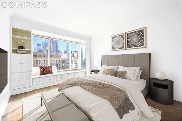 bedroom featuring hardwood / wood-style floors and crown molding