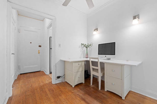 office area with a ceiling fan, ornamental molding, and light wood-style floors