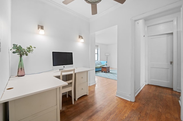office area with crown molding, ceiling fan, baseboards, and light wood-type flooring