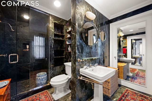 bathroom with tile walls, crown molding, a shower with shower door, and toilet