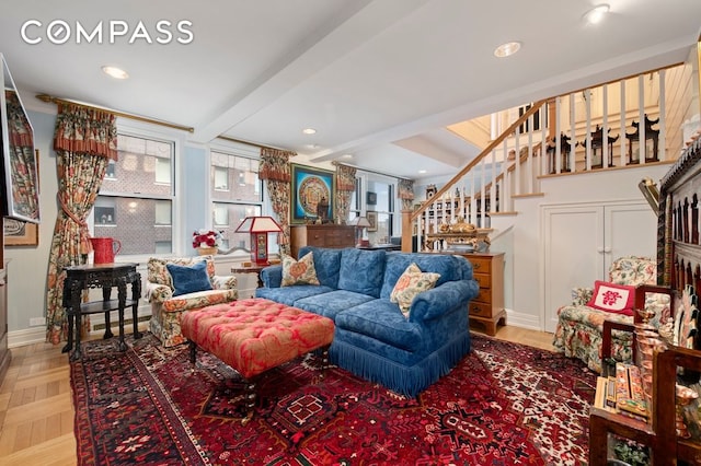 living area with stairs, beam ceiling, baseboards, and recessed lighting