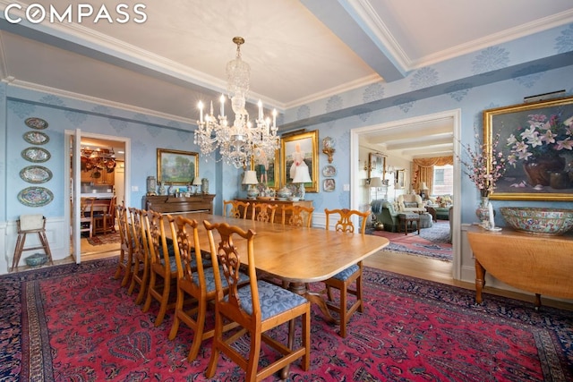 dining room with crown molding, wood-type flooring, and a chandelier