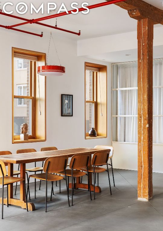 dining area featuring concrete flooring