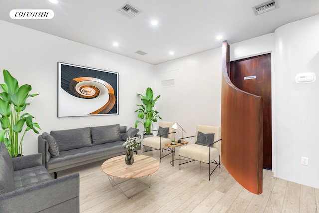 living room with light hardwood / wood-style floors