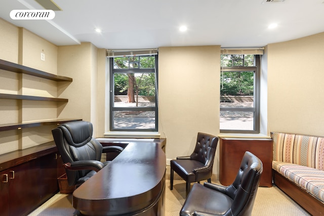 carpeted office with recessed lighting, a healthy amount of sunlight, and visible vents