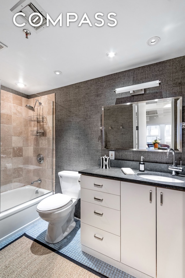 full bath featuring tile patterned flooring, toilet, recessed lighting, shower / bathtub combination, and vanity