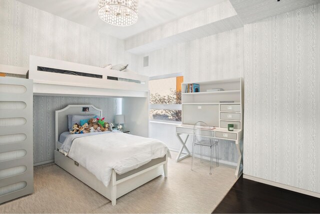 515 W 23rd St Unit 6Flr, New York City, NY 10011 - bedroom featuring a chandelier, wallpapered walls, wood finished floors, and visible vents