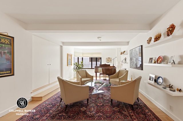 living area with beam ceiling