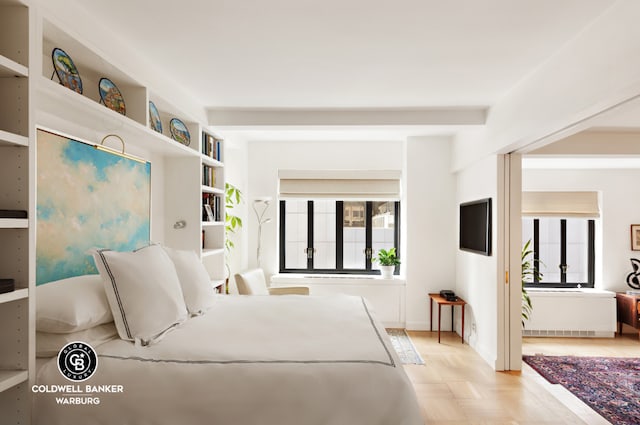 bedroom with light parquet floors