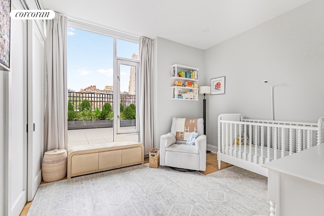 bedroom featuring a nursery area