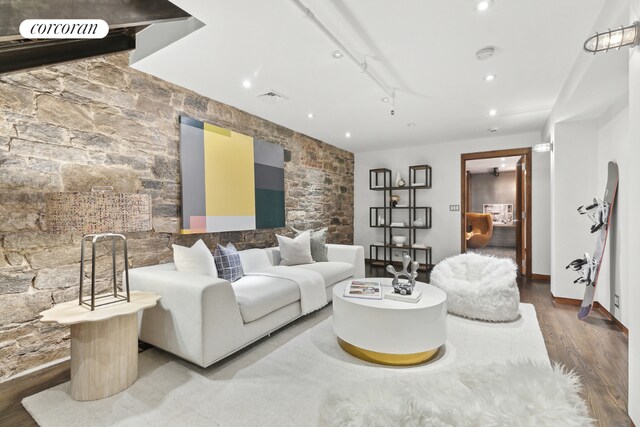 staircase with beverage cooler and brick wall