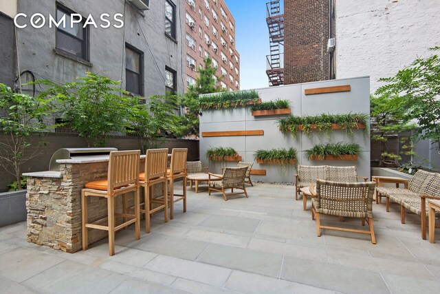 view of patio / terrace featuring outdoor dry bar