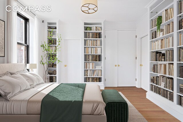 dining space with hardwood / wood-style floors, ornamental molding, and built in features