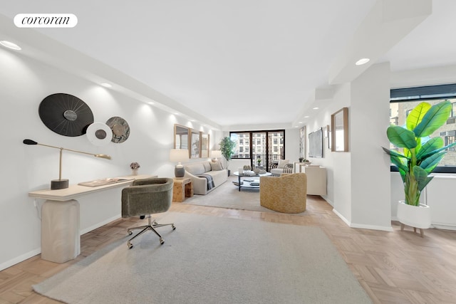 living area with recessed lighting, visible vents, and baseboards