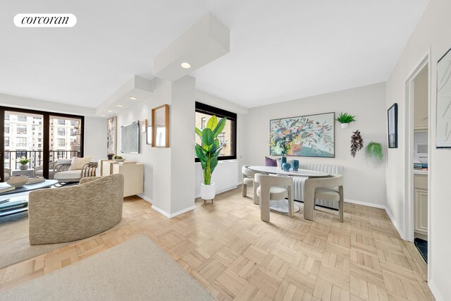 living room featuring light parquet floors