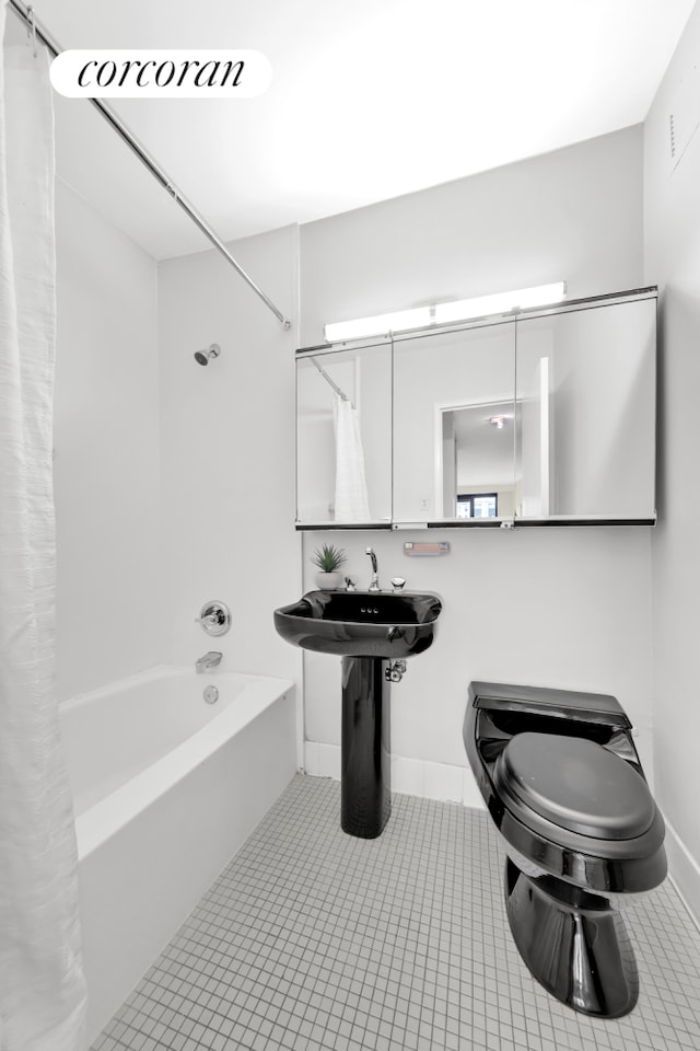 10 W 66th St Unit 12B, New York City, NY 10023 - full bath with shower / bath combination with curtain and tile patterned floors