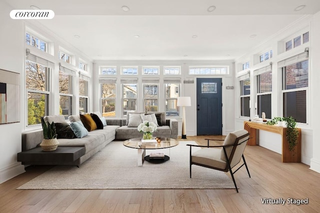 sunroom with a wealth of natural light and visible vents