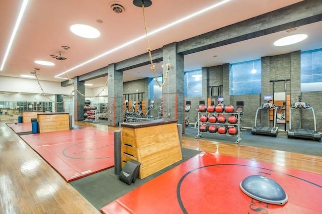 gym featuring wood finished floors