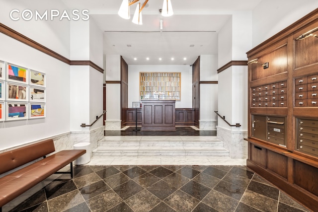 lobby featuring a wainscoted wall
