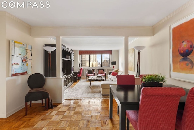 dining space with crown molding and light parquet flooring