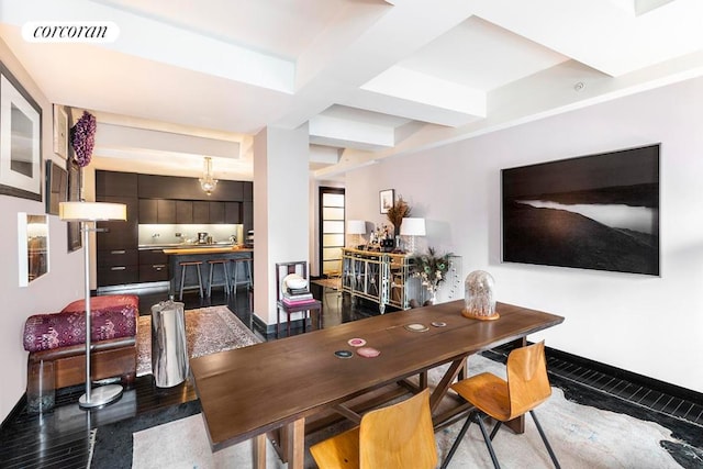 dining room featuring dark hardwood / wood-style floors and beamed ceiling