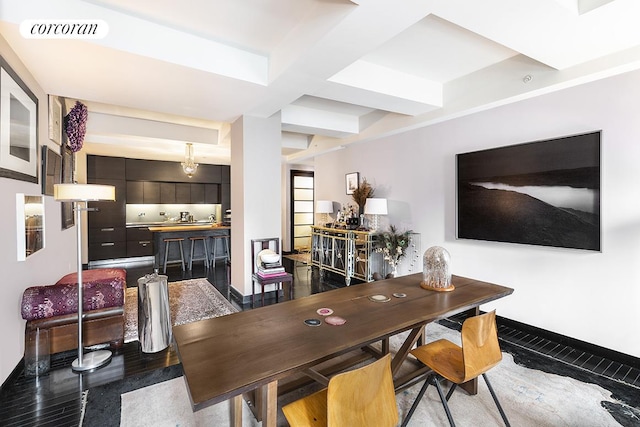 dining space with baseboards, visible vents, coffered ceiling, and beam ceiling