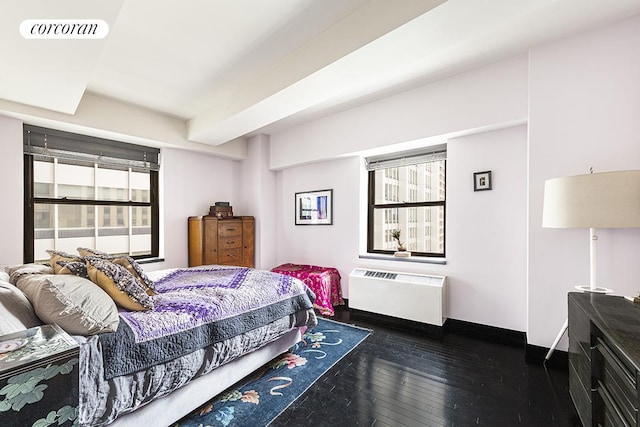 bedroom with dark wood-type flooring and visible vents