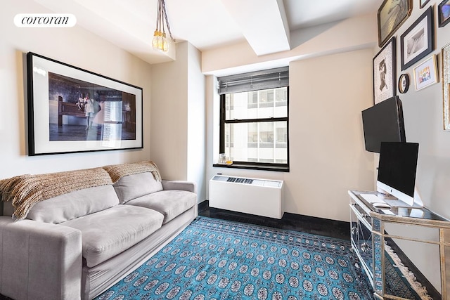 living room with baseboards and visible vents