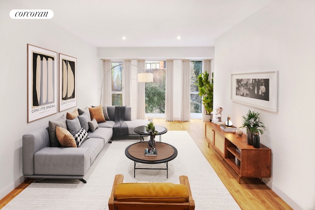 living area with light wood-style floors, baseboards, visible vents, and recessed lighting