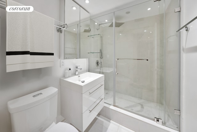 full bathroom featuring a stall shower, vanity, toilet, and recessed lighting