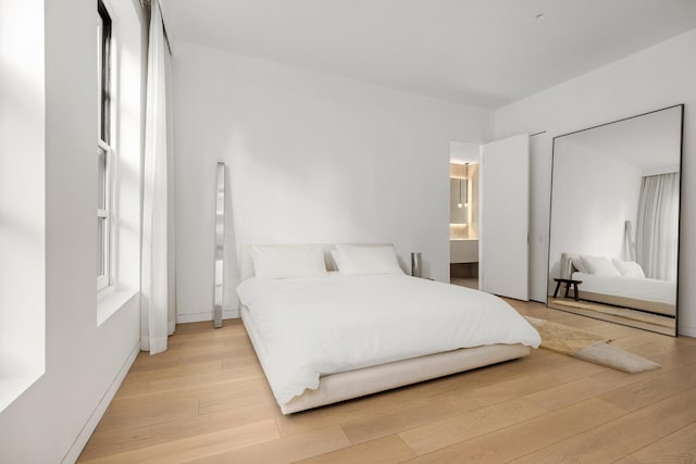 bedroom with light wood-style flooring