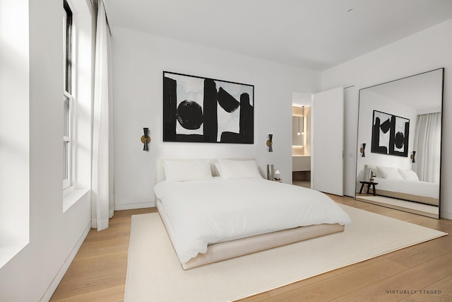 bedroom featuring light wood finished floors