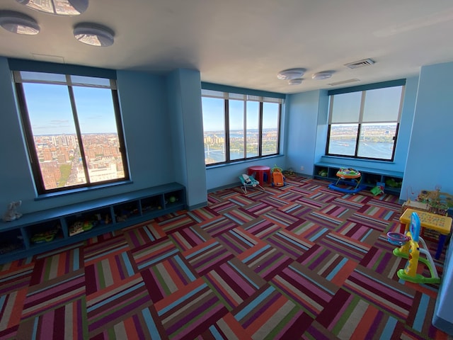 game room featuring carpet and visible vents