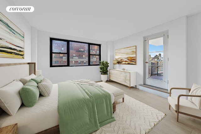 bedroom with light hardwood / wood-style floors and access to outside