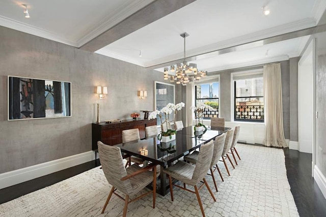 dining space with an inviting chandelier, ornamental molding, beam ceiling, and dark wood-type flooring