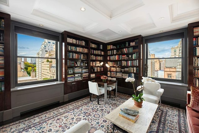 sitting room featuring ornamental molding, coffered ceiling, and beam ceiling