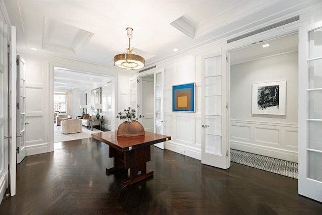 interior space with dark parquet flooring, ornamental molding, and french doors