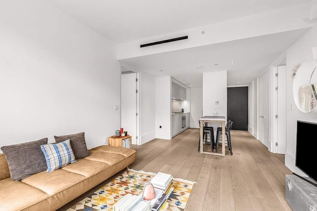 living room featuring light wood-type flooring