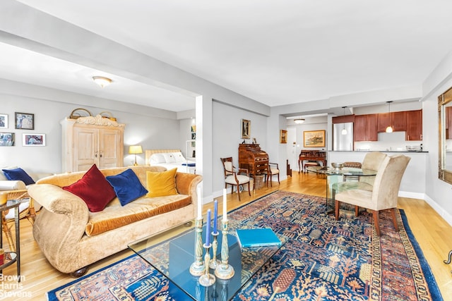 living room with light wood-style floors and baseboards